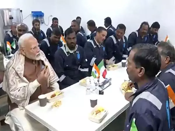 Prime Minister Narendra Modi meets Indian migrant workers at Gulf Spic Labour Camp in Kuwait